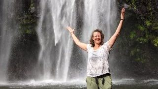 Amy Pattee Colvin at Materuni Waterfall on the Tanzania Spiritual Tour