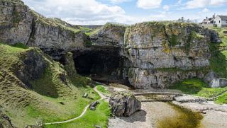 The entrance to Smoo Cave which leads to a hidden waterfall. 