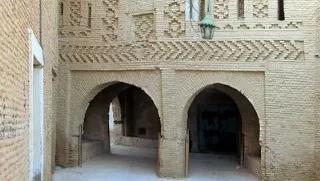 The Tozeur medina reflects complex brickwork patterns.