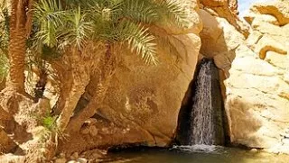 Tamerza Waterfall Descend into the limestone walls of Midès Canyon, hiking along the palm gorge to the waterfalls of Tamerza.